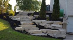 Silver Creek outcropping stone retaining wall with steps